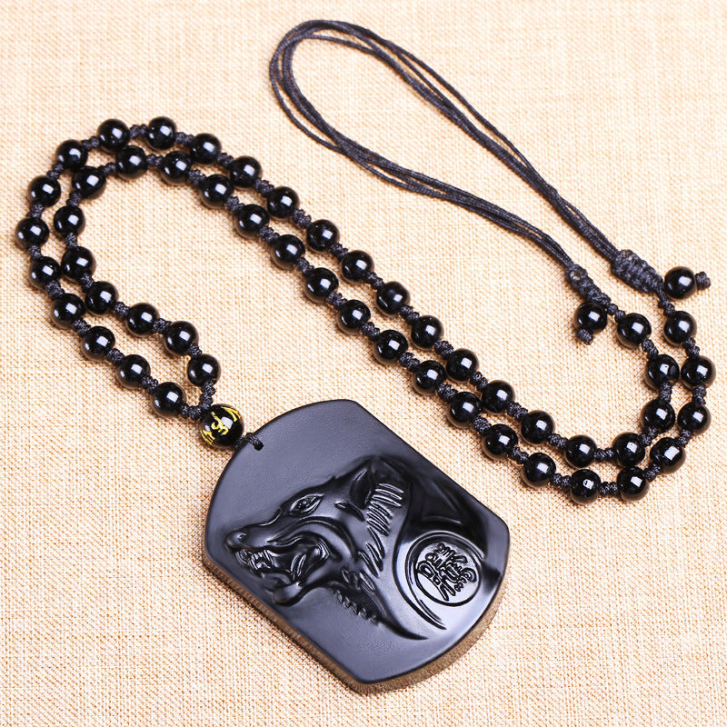 Collier obsidienne noire avec symbole de loup
